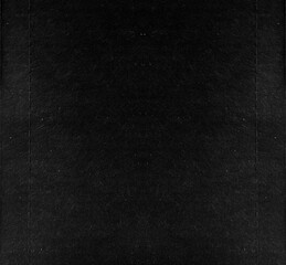 Black paper background. Contrast and minimalism concept.