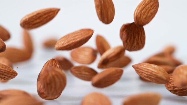 Super Slow Motion Shot of Falling Almonds.
