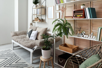 Interior of modern living room with sofa and shelf unit