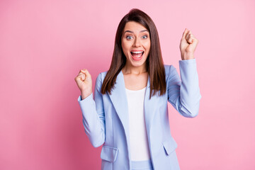 Photo of young happy excited cheerful smiling businesswoman open mouth hold fists isolated on pink color background