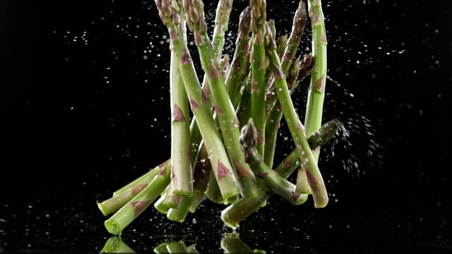 Super slow motion of falling asparagus