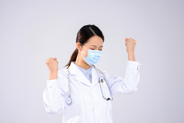 A young woman doctor with a mask boomed