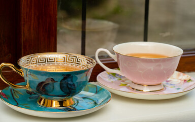 Hot tea in porcelain tea cups