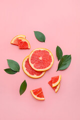 Fresh sliced grapefruit on color background