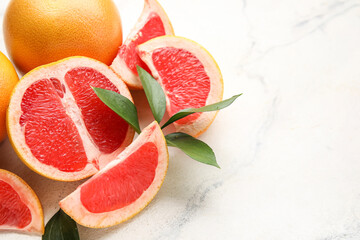 Fresh grapefruits on light background