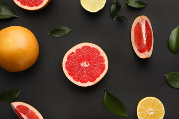 Fresh citrus fruits on dark background