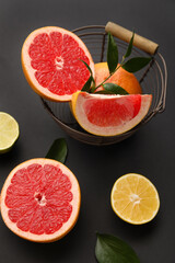 Fresh citrus fruits on dark background