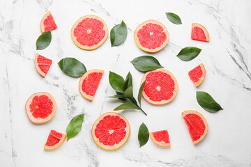 Fresh sliced grapefruit on light background