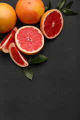Fresh grapefruits on dark background