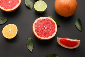 Fresh citrus fruits on dark background