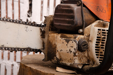 Chainsaw with traces of operation close-up of elements