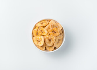 Banana chips on a light background.