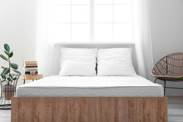 Soft orthopedic mattress on bed in room - obrazy, fototapety, plakaty