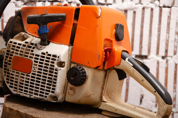 Chainsaw with traces of operation close-up of elements