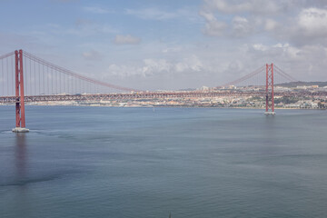 wide panorama overlooking the river and the big bridge on April 25 in Lisbon, Portugal