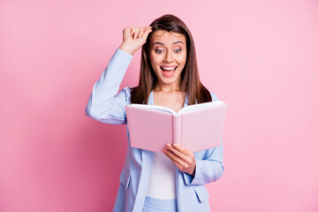 Photo of young woman amazed excited surprised news happy smile read book hand touch glasses isolated over pink color background