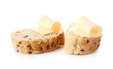 Slices of fresh bread with butter on white background