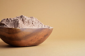 Close up. Bowl full of cocoa powder. Copy space.