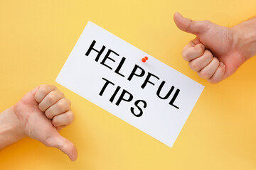 Male hands show signs of approval or disapproval. Postcard with the inscription Helpful Tips