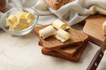 Fototapeta na wymiar Composition with fresh bread and butter on light background, closeup