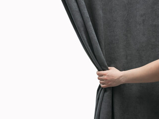 The woman's hand open gray curtain
