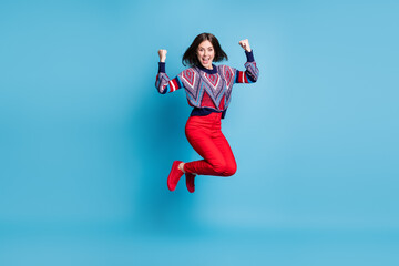 Fototapeta na wymiar Full length body size view of attractive lucky cheerful girl jumping rejoicing isolated over bright blue color background