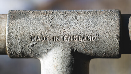 Made in England text on old metal pipe