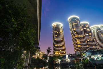 A contrast scene between new modern buildings and slums in developing countries like Vietnam. A landscape represents a reflection between rich and poor