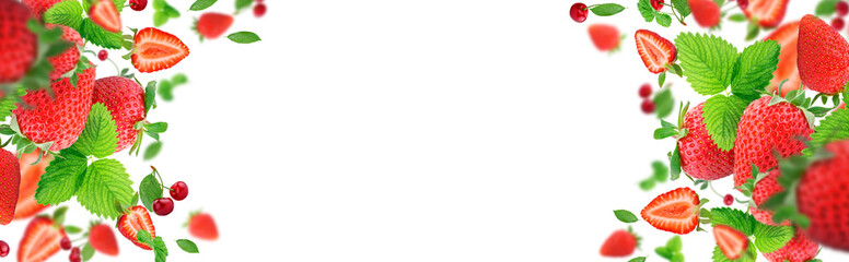 Strawberry berries and cherry berries levitating on a white background. Isolated object on a white background. Horizontal. Selective focus. Levitate.