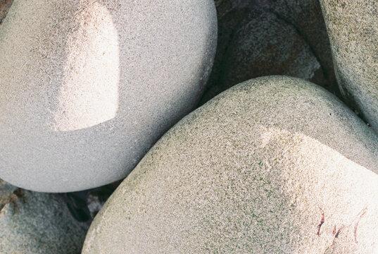 Close up of curved rocks on beach