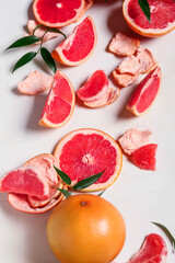 Composition with ripe grapefruits on white background