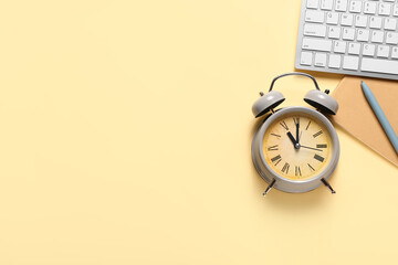 Composition with alarm clock on color background