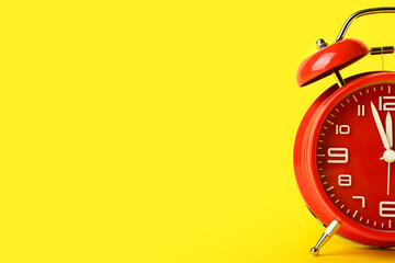 Alarm clock on color background