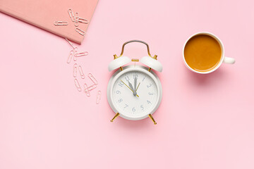 Composition with alarm clock and cup of coffee on color background