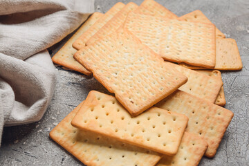 Tasty crackers on grunge background