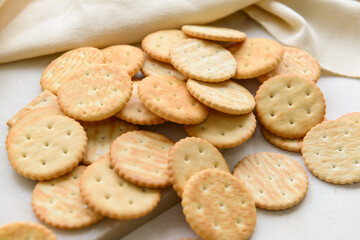 Tasty crackers on light background
