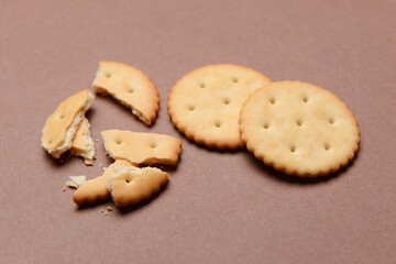 Tasty crackers on color background