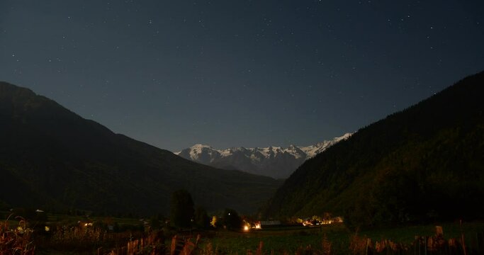 Long-exposure time lapse shot of the Stars Galaxy over the mountains in Mestia, Georgia