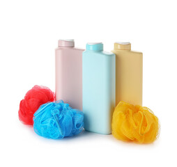 Fototapeta na wymiar Different bottles of shower gel and sponges on white background