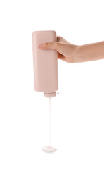Woman pouring shower gel on white background