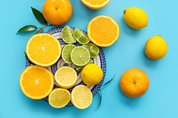 Fototapeta na wymiar Fresh citrus fruits on color background