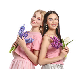 Beautiful young women with hyacinth flowers on white  background