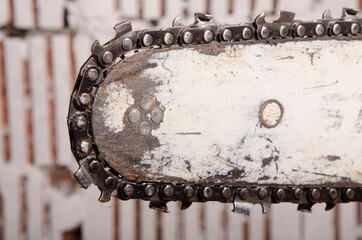 Chainsaw with traces of work close-up of chain teeth
