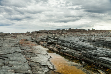 View of the rocky coast of the Barents Sea on the Kola Peninsula, Russia.