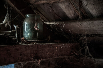 dusty glass with cobwebs in an old abandoned house