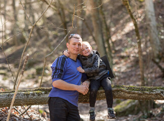 touching tender communication of the father with the son in the forest.