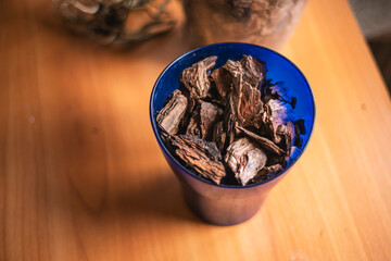 dry bark for phalaenopsis, growing ornamental plants at home, tree bark as soil for orchids on the table