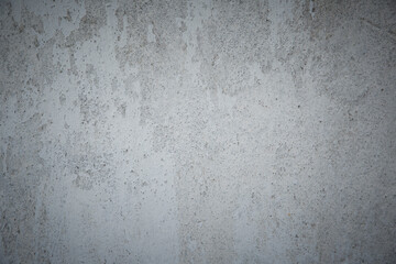 White grey old wall with shabby damaged plaster.