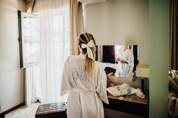 wedding details for bride and maid of honor pink and white bathrobes 