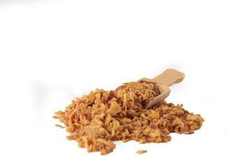 a pile of dried onion powder and a wooden spoon isolated on white background